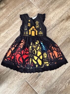 Taylor Black Castle Dress with Red Orange Yellow and Blue Accents